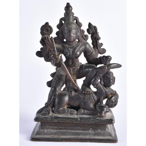 377 - AN 18TH CENTURY INDIAIN BRONZE FIGURE OF A DEITY modelled standing upon a beast. 12 cm x 7 cm.