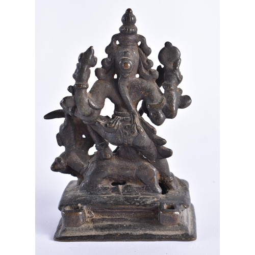 377 - AN 18TH CENTURY INDIAIN BRONZE FIGURE OF A DEITY modelled standing upon a beast. 12 cm x 7 cm.