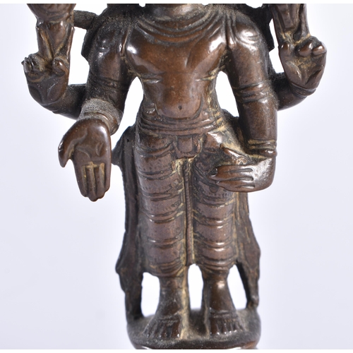 378 - AN 18TH CENTURY INDIAIN BRONZE FIGURE OF A DEITY modelled standing with one hand downturned. 11 cm h... 