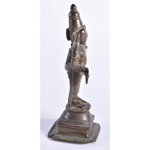 378 - AN 18TH CENTURY INDIAIN BRONZE FIGURE OF A DEITY modelled standing with one hand downturned. 11 cm h... 