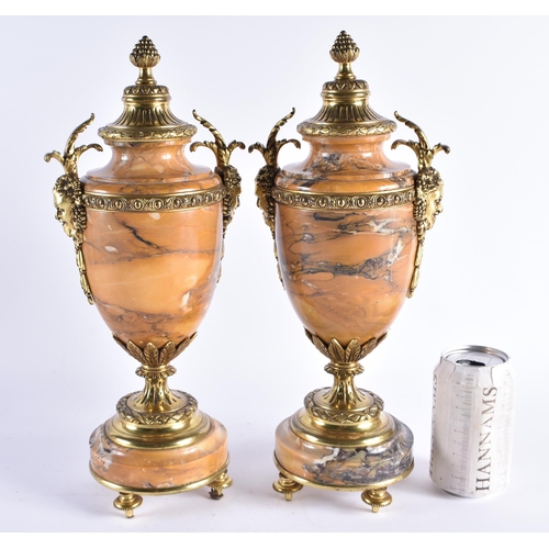 380 - A FINE PAIR OF 19TH CENTURY FRENCH GILT BRONZE SIENNA MARBLE URNS overlaid with bacchus mask heads. ... 