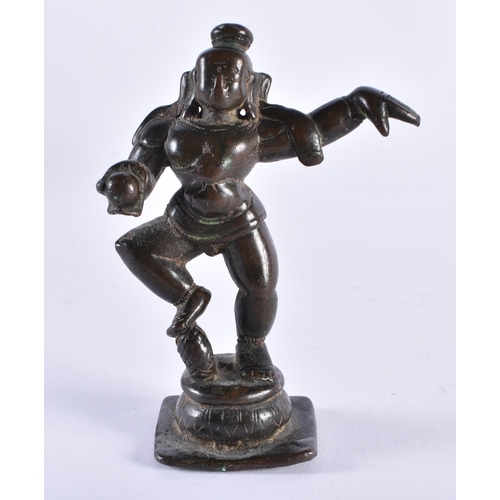 385 - AN 18TH CENTURY INDIAN BRONZE FIGURE OF A HINDU DEITY modelled with one side arm raised. 11 cm high.