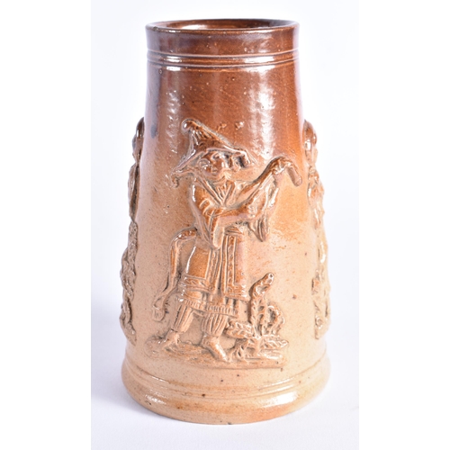 398 - A RARE MID 19TH CENTURY STONEWARE SHAVING MUG decorated with figural sprigs. 14 cm high.