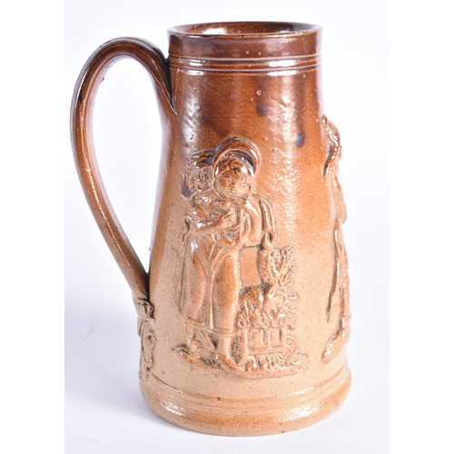 398 - A RARE MID 19TH CENTURY STONEWARE SHAVING MUG decorated with figural sprigs. 14 cm high.