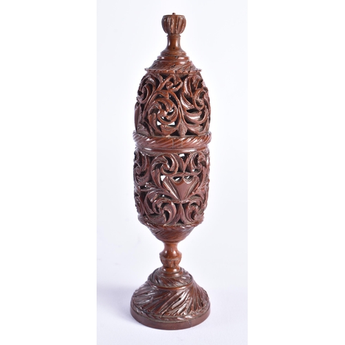 400 - A FINE 19TH CENTURY TREEN CARVED COQUILLA NUT VASE AND COVER possibly a parfumier. 17 cm high.