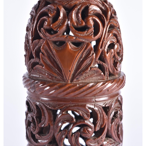 400 - A FINE 19TH CENTURY TREEN CARVED COQUILLA NUT VASE AND COVER possibly a parfumier. 17 cm high.