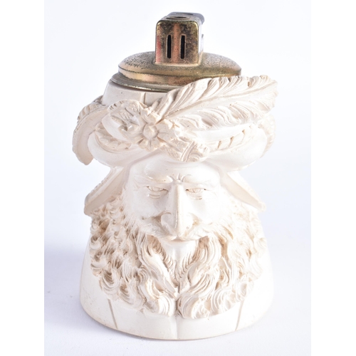 403 - AN UNUSUAL CARVED MEERSCHAUM TURKISH MAN TABLE LIGHTER together with an unusual sand glass oil lamp.... 