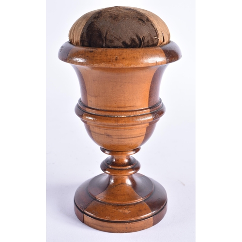 408 - AN ANTIQUE TREEN LIGNUM VITAE CARVED WOOD PIN CUSHION. 18 cm high.