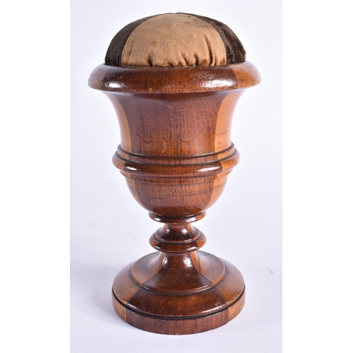 408 - AN ANTIQUE TREEN LIGNUM VITAE CARVED WOOD PIN CUSHION. 18 cm high.