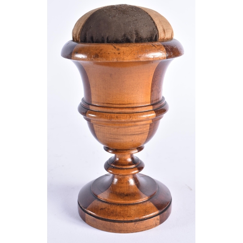 408 - AN ANTIQUE TREEN LIGNUM VITAE CARVED WOOD PIN CUSHION. 18 cm high.