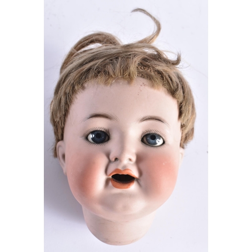 409 - AN UNUSUAL ANTIQUE GERMAN SIMON HALBIG MALE BISQUE PORCELAIN DOLL HEAD. 21 cm x 12 cm.