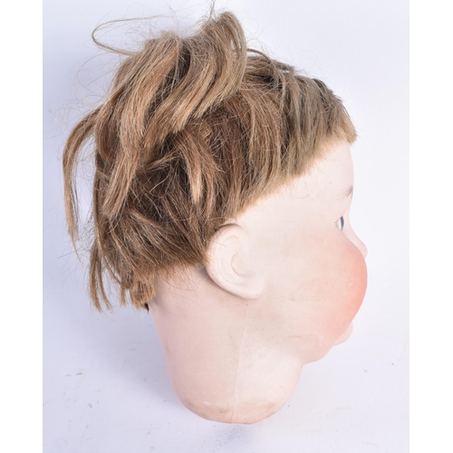 409 - AN UNUSUAL ANTIQUE GERMAN SIMON HALBIG MALE BISQUE PORCELAIN DOLL HEAD. 21 cm x 12 cm.