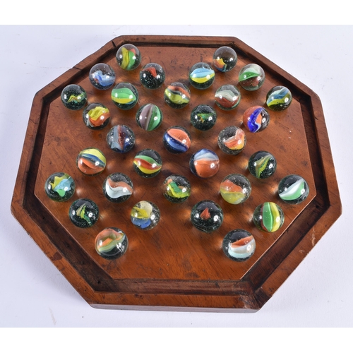 412 - A LARGE ANTIQUE SOLITAIRE MARBLE BOARD with marbles. 29 cm wide, marbles 2.75 cm diameter. (qty)