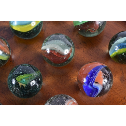 412 - A LARGE ANTIQUE SOLITAIRE MARBLE BOARD with marbles. 29 cm wide, marbles 2.75 cm diameter. (qty)