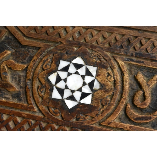 415 - A 19TH CENTURY MIDDLE EASTERN ISLAMIC CARVED WOOD TABLE decorated with calligraphy. 79cm x 75cm x 47... 