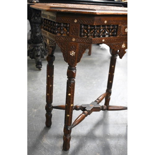 415 - A 19TH CENTURY MIDDLE EASTERN ISLAMIC CARVED WOOD TABLE decorated with calligraphy. 79cm x 75cm x 47... 