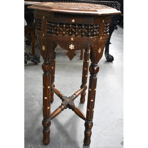 415 - A 19TH CENTURY MIDDLE EASTERN ISLAMIC CARVED WOOD TABLE decorated with calligraphy. 79cm x 75cm x 47... 