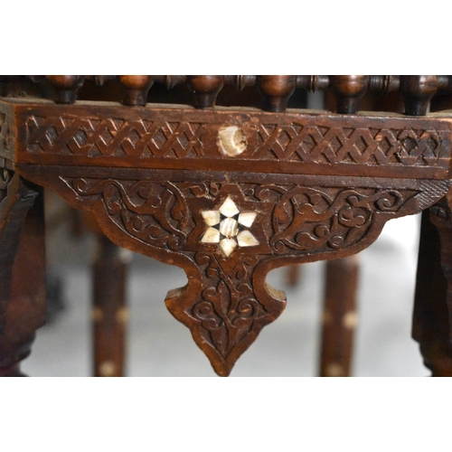 415 - A 19TH CENTURY MIDDLE EASTERN ISLAMIC CARVED WOOD TABLE decorated with calligraphy. 79cm x 75cm x 47... 