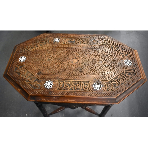 415 - A 19TH CENTURY MIDDLE EASTERN ISLAMIC CARVED WOOD TABLE decorated with calligraphy. 79cm x 75cm x 47... 