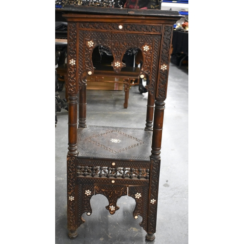 418 - A 19TH CENTURY MIDDLE EASTERN ISLAMIC CARVED WOOD TABLE decorated with calligraphy. 100cm x 45cm x 4... 