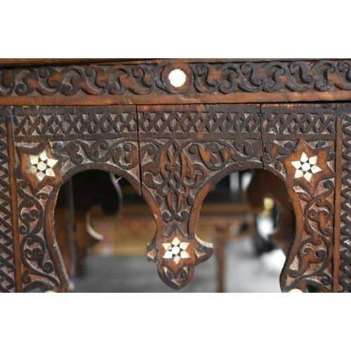 418 - A 19TH CENTURY MIDDLE EASTERN ISLAMIC CARVED WOOD TABLE decorated with calligraphy. 100cm x 45cm x 4... 