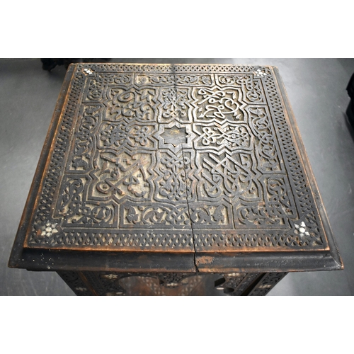 418 - A 19TH CENTURY MIDDLE EASTERN ISLAMIC CARVED WOOD TABLE decorated with calligraphy. 100cm x 45cm x 4... 