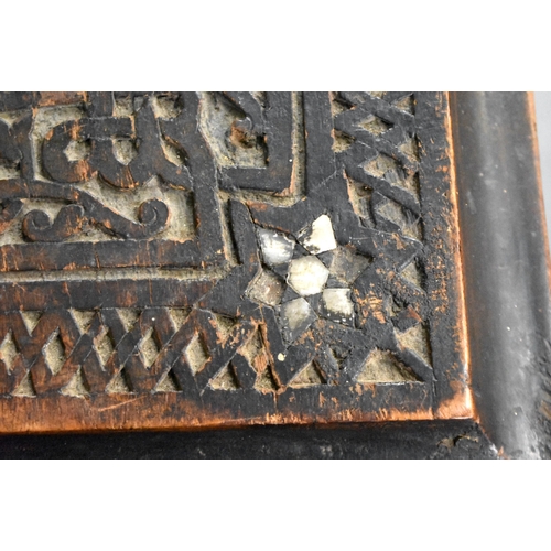 418 - A 19TH CENTURY MIDDLE EASTERN ISLAMIC CARVED WOOD TABLE decorated with calligraphy. 100cm x 45cm x 4... 