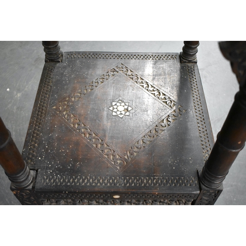 418 - A 19TH CENTURY MIDDLE EASTERN ISLAMIC CARVED WOOD TABLE decorated with calligraphy. 100cm x 45cm x 4... 