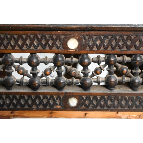 418 - A 19TH CENTURY MIDDLE EASTERN ISLAMIC CARVED WOOD TABLE decorated with calligraphy. 100cm x 45cm x 4... 