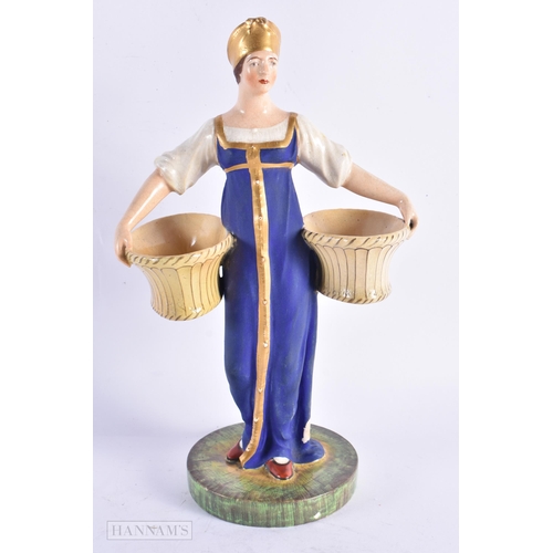 419 - A LATE 19TH CENTURY RUSSIAN PORCELAIN FIGURE modelled as a female holding two baskets. 23 cm high.