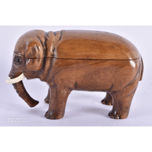 420 - AN EARLY 19TH CENTURY CARVED TREEN WOOD SNUFF BOX modelled as an elephant. 8 cm wide.