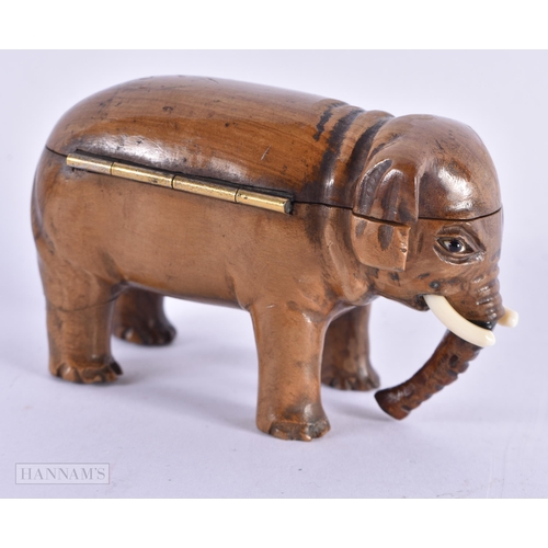 420 - AN EARLY 19TH CENTURY CARVED TREEN WOOD SNUFF BOX modelled as an elephant. 8 cm wide.