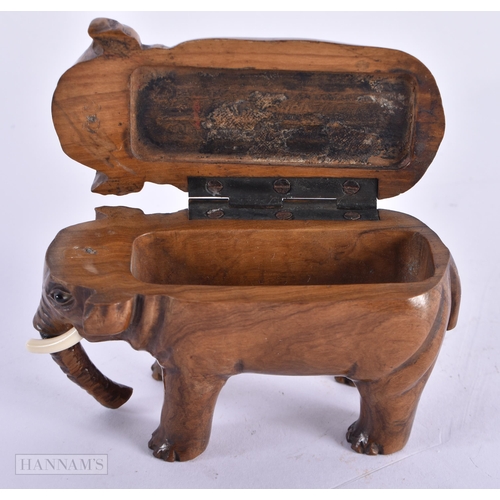 420 - AN EARLY 19TH CENTURY CARVED TREEN WOOD SNUFF BOX modelled as an elephant. 8 cm wide.