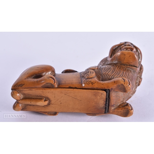 421 - AN 18TH CENTURY TREEN CARVED WOOD SNUFF BOX formed as a scowling recumbant lion. 10 cm x 6 cm.