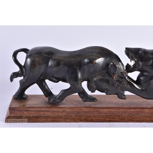 431 - A LARGE 19TH CENTURY ANGLO INDIAN CARVED RHINOCEROS HORN ANIMAL GROUP modelled as a lion fighting a ... 