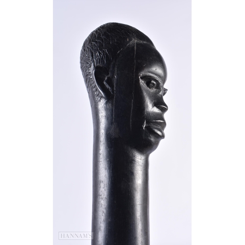 433 - AN AFRICAN TRIBAL EBONY FIGURAL WALKING CANE. 100 cm long.