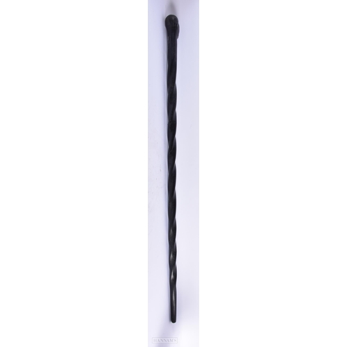 433 - AN AFRICAN TRIBAL EBONY FIGURAL WALKING CANE. 100 cm long.