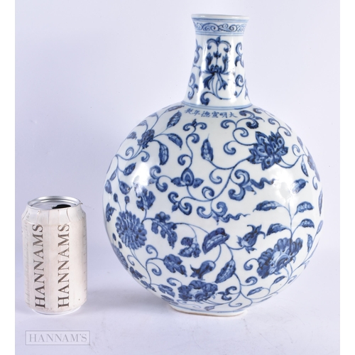 435 - A LARGE CHINESE BLUE AND WHITE PORCELAIN FLASK painted with flowers. 32 cm x 20 cm.