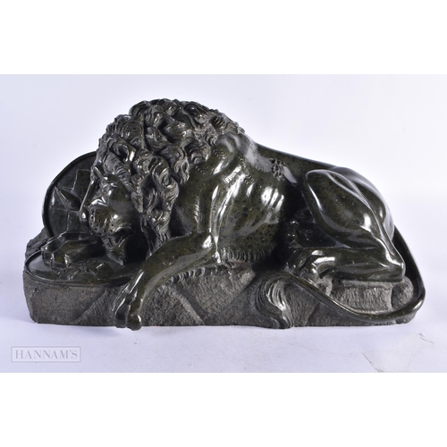 448 - A LOVELY LARGE 19TH CENTURY EUROPEAN GRAND TOUR SERPENTINE LION modelled recumbant. 38 cm x 28 cm.