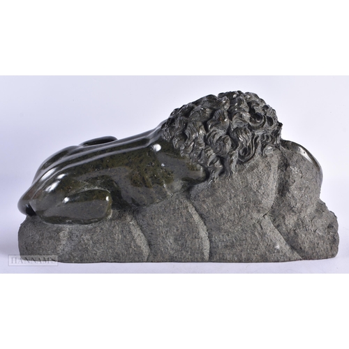 448 - A LOVELY LARGE 19TH CENTURY EUROPEAN GRAND TOUR SERPENTINE LION modelled recumbant. 38 cm x 28 cm.