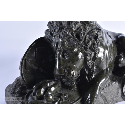 448 - A LOVELY LARGE 19TH CENTURY EUROPEAN GRAND TOUR SERPENTINE LION modelled recumbant. 38 cm x 28 cm.