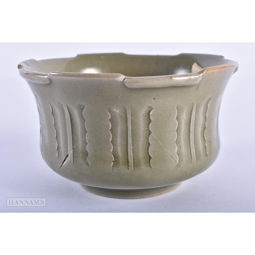 45D - AN UNUSUAL CHINESE QING DYNASTY CELADON BOWL incised with calligraphy. 8cm x 13.5 cm