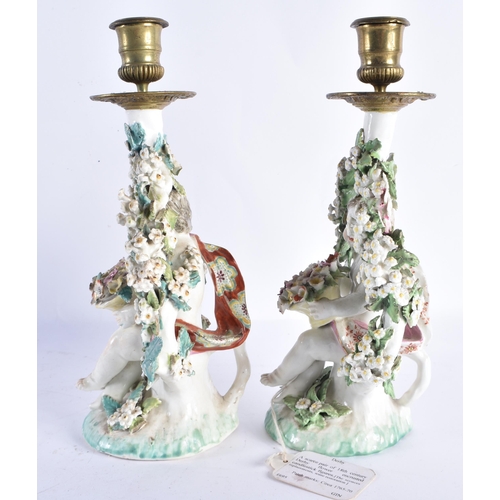 47 - A RARE PAIR OF 18TH CENTURY DERBY PORCELAIN CANDLESTICKS formed as figures holding baskets of flower... 