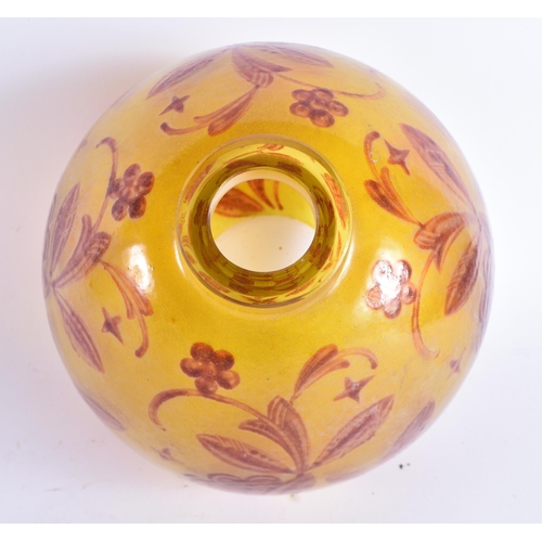 482 - AN UNUSUAL EARLY 20TH EUROPEAN YELLOW GLASS BULBOUS VASE decorated with red foliage. 22 cm x 17 cm.