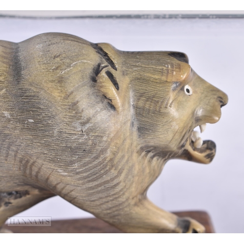 491 - THREE 19TH CENTURY ANGLO INDIAN CARVED RHINOCEROS HORN ANIMALS. Largest 23 cm long. (3)