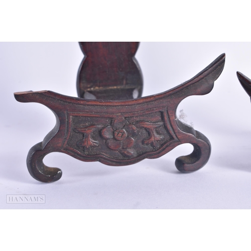 498 - TWO 19TH CENTURY CHINESE CARVED HARDWOOD DISPLAY STANDS. Largest 18 cm high. (2)