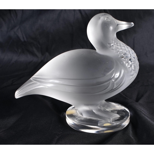 512 - A LALIQUE GLASS DUCK. 13 cm wide.