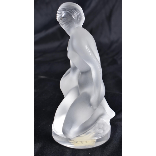 525 - A LALIQUE GLASS NUDE FEMALE. 12 cm high.