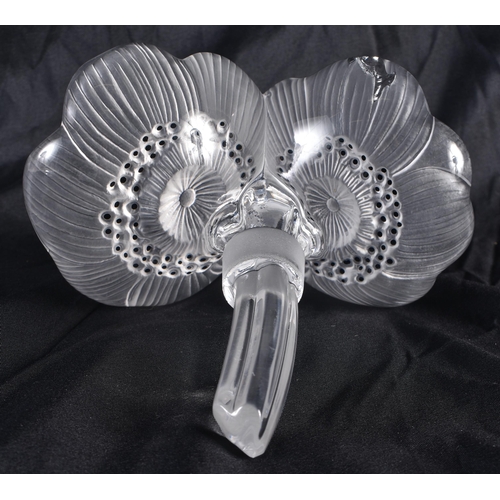 528 - A LALIQUE GLASS FLOWER. 13 cm high.