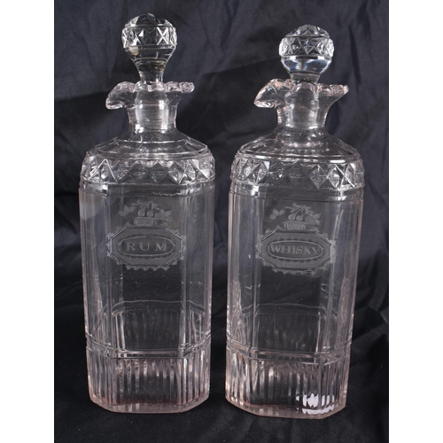 542 - A PAIR OF REGENCY CUT GLASS RUM AND WHISKEY DECANTERS. 22 cm high.